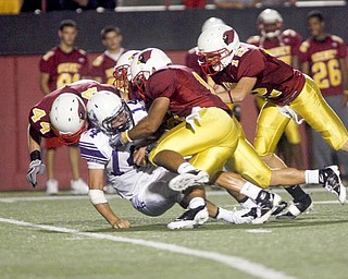 The Vindicator/Robert K. Yosay ----DROPPED FOR A LOSS - DeSales #14 Nick Gentile is dropped for a loss by a host of mooney players including #44 Mark Brandenstein #12 Joe Stoops others are unidentifed -942009
