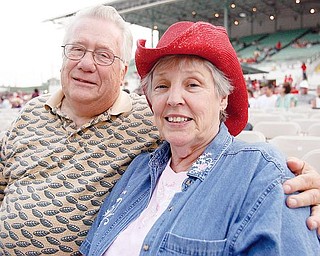 MUSIC FANS: Wayne and Karen Walter of Niles were among the first to get into the Canfield Fair’s Grandstand to enjoy the country music concert featuring George Jones and Hank Williams Jr.