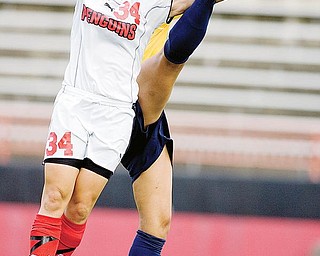YSU's Kara Cooper goes up for a header with Kent State's Jackie Barath during the second half.