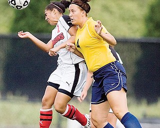 YSU's Cori Stark goes up for a header with Kent State's Kelsey Knoll during the second half.