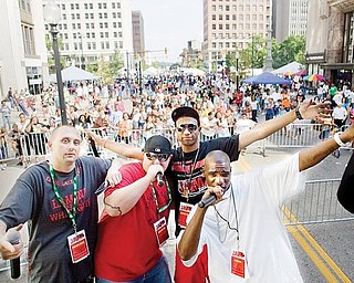 Lucky Penny (2nd from right) shares the stage with personalities from the radio show Lamont and two white guys comprised of, Lamont (far right), Pistol Pete (far left) and DJ ME (second from left) during the Lucky Penny Family Reunion at Federal Plaza on Sunday afternoon.