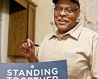 FAN OF REFORM: Jerome Parm of Organizing for America hosted a house party at the home of Penny Wells in Boardman. Group members and their guests watched President Barack Obama’s speech on health-care reform Wednesday evening.