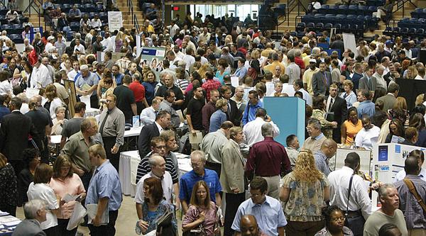 CROWDED FLOOR: Thousands of jobless people packed into the downtown arena Wednesday for Job Expo 2009. Companies at the expo were advertising 1,000 job openings.