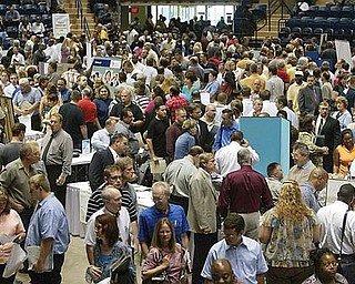 CROWDED FLOOR: Thousands of jobless people packed into the downtown arena Wednesday for Job Expo 2009. Companies at the expo were advertising 1,000 job openings.