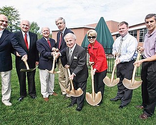 ALL SMILES: Dignitaries break ground for the $6 million expansion of the D.D. & Velma Davis Family Branch of the YMCA in Boardman. Participating in Thursday’s event were, from left, Greg Strollo of Strollo Architects; C. Robert Buchanan, a YMCA board member; Ken Rudge, president and chief executive officer of the Youngstown YMCA; John Yerian, chairman of the YMCA’s trustee board; Tony Lariccia, businessman and philanthropist, and his wife, Mary; Doug Lumsden Jr.; and Tom Grantonic, Boardman Y director.