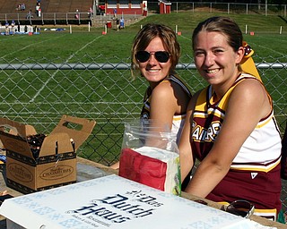 South Range senior cheerleaders Courtney Driscoll and Brittany Haynes
sell refreshments at the JV game to raise money for the Pink Ribbon
Classic.