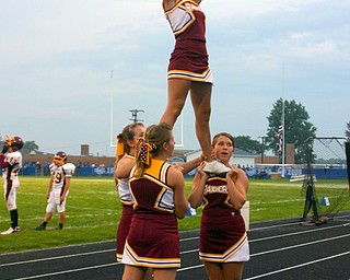 Senior cheerleaders Danielle Pendice, Jesse Heck, Courtney Driscoll,
and Brittany Haynes cheer the South Range crowd on