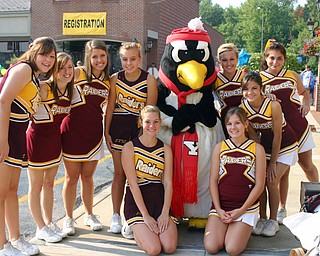 South Range cheerleaders hang out with YSU's Pete the Penquin at the
recent Buddy Walk at the Shops on Boardman Park.