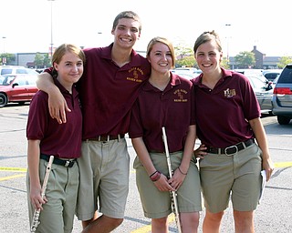 South Range Band Member Ethan Parks hangs out with friends Krista
White, Rachel Lipp, and Emily Deiger as they wait to play at the Buddy
Walk held recently at the Shops on Boardman Park.