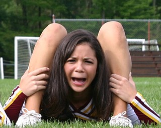 South Range Cheerleader Kim Miglets is not sure her legs should bend
quite like that!