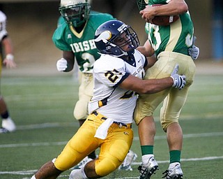 The Vindicator/Robert K. Yosay -- Ursulines #33 Jeff Pedolsky breaks away ffrom Vikings #21 Brian Palermo during first quarter action at Wheeling Island Stadium 952009