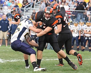 MCDONALD - MINERAL RIDGE - (5) Dan Skiba tries to get away from (25) Nick Rota of Mcdonald during their game Friday night. - Special to The Vindicator/Nick Mays