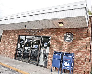 STAYING OPEN: This storefront post office at 2030 Mahoning Avenue on Youngstown’s West Side has been removed from the U.S. Postal Service’s potential closing list, but the city’s East and South side post offices remain on that list. Residents in the community launched a campaign to
keep the West Side branch open. 