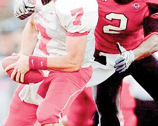 YSU's Andre Elliot (2) sacks Austin Peay's Trent Caffee (7) during the fourth quarter on Saturday afternoon at Stambaugh Stadium.