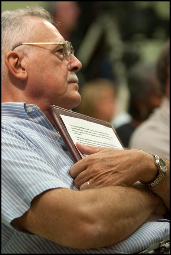The Vindicato/Geoffrey HauschildDan Bienko, of Canfield, holds his printed question addressing his concerns over how private entities could compete with a public option during the Health Debate with Congressman Tim Ryan at the  Jewish Community Center in Youngstown on Monday evening. All attendees attended by invitation only however Bienko did not win in the drawing and was not able to ask his question.9.14.2009