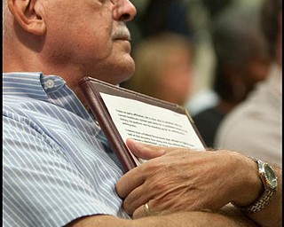 The Vindicato/Geoffrey HauschildDan Bienko, of Canfield, holds his printed question addressing his concerns over how private entities could compete with a public option during the Health Debate with Congressman Tim Ryan at the  Jewish Community Center in Youngstown on Monday evening. All attendees attended by invitation only however Bienko did not win in the drawing and was not able to ask his question.9.14.2009