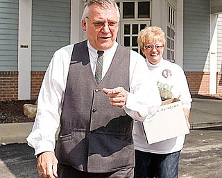 TRAFICANT ON THE AIR: Ex-U.S. Rep. James A. Traficant Jr. leaves the WKBN-AM radio studio in Boardman after hosting a show. Traficant took calls from 21 people, none of whom criticized him. Behind Traficant is Linda Kovachik, a longtime friend and former congressional staffer.