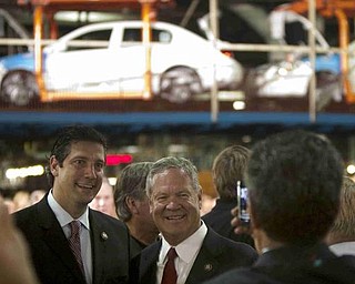 The Vindicator/Geoffrey Hauschild
Congressmen Tim Ryan and Senator Charlie Wilson have their photograph taken while waiting for President Obama to address an audience at the Lordstown Auto Plant on Tuesday morning.
9.15.2009