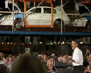 The Vindicator/Geoffrey Hauschild
President Obama addresses an audience in front of a halted production line of Chevy Colbalts at the Lordstown Auto Plant on Tuesday morning.
9.15.2009