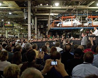 The Vindicator/Geoffrey Hauschild
President Obama addresses an audience in front of a halted production line of Chevy Colbalts at the Lordstown Auto Plant on Tuesday morning.
9.15.2009