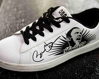 The Vindicator/Geoffrey Hauschild
__ shoe signed by the president at the Lordstown Auto Plant on Tuesday morning. 
9.15.2009