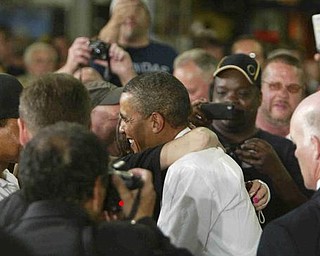 Obama gets a hug from Patty Logan of the Fab Plant and hermitage- robertkyosay
