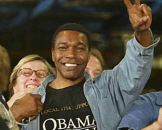 David Bell of Warren proudly shows off his shirt and waves at the president - robertkyosayThe Vindicator/Robert K. Yosay ----- Obama speaks to  GM workers and guests at the Lordstown GM Plant  Tuesday  - 9-15-09