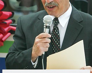 EXPANDED SERVICES: James Ferraro, executive director of Western Reserve Transit Authority, speaks to elected officials and other guests at a ribbon-cutting ceremony at St. Elizabeth Health Center Boardman, marking the start of the transit authority’s countywide bus service.