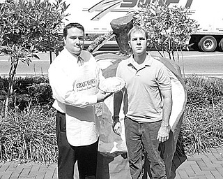 Special to The Vindicator
UPPER CRUST: This year’s Johnny Appleseed Festival in Lisbon promises to have appeal for all apple lovers as the third annual pie-baking contest gets under way. Craig Brown, chamber of commerce vice president, left, and Ryan Hillman, chamber president, seem eager for the taste testing to begin. The festival will take place Saturday and Sunday.