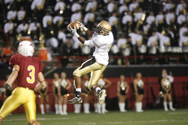 The Vindicator/Robert K. Yosay  Big Gain -  Hardings #7  Deen Franklin  goes airborne  to catch the first and 10 pass as Mooneys #3 John Stoops looks on during first half action at Stambaugh Stadium - -----9-18-2009