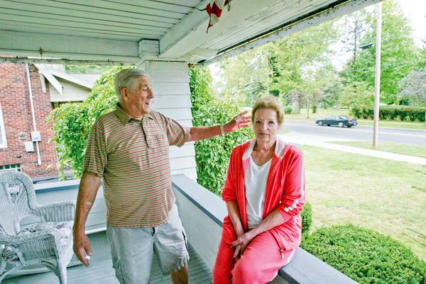 SKATE-BOARD PARK: Steve and Donis Sardich sit on their front porch on Mahoning Avenue N.W. in Warren near the former Turner Junior High School and Middle School, where the city has proposed building a skate board park.