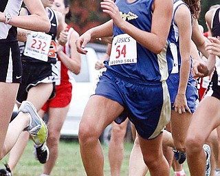 EMERGING FROM THE PACK: Brookfield junior Angie Kirila maneuvers through the pack during Tuesday’s Suburban League championships at the Canfield Fairgrounds. She finished first.
