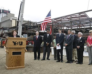 The Vindicator/Robert K. Yosay --Dean Betty Jo Licata, Ph.Dand  University officials and others will sign the final steel beam going into the $34,3 million building.  The beam, carrying U.S. and YSU flags, will then be hoisted into place.  110,000-square-foot facility to  ready for occupancy in fall 2010.  YSU is raising $16 million in private donations to help pay for the construction. 

0232009