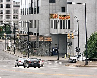 END IN SIGHT: Scaffolding in place for more than a year at the National City Bank building in downtown Youngstown will soon be removed as building owner Park South Development Co. LLC plans a $1 million improvement to its exterior. 