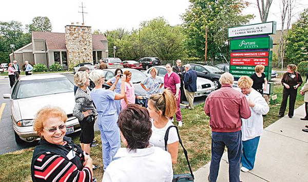 Hubbard care center: People gather to take a look at the new Forum Health immediate-care center on North Main Street in Hubbard. The facility opened Wednesday, and staff there will treat minor illnesses and injuries such as small fractures and cuts.