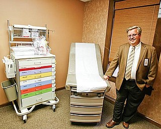A LOOK INSIDE: Michael Seelman, chief operating officer of Forum Health Services, shows off one of the five examination rooms in the Hubbard immediate-care center on North Main Street, which opened to the public Wednesday. 