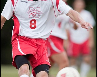 The Vindicator/Geoffrey HauschildMathew's Jason Buzzeo (8) kicks a pass during the second half of a game at Mathews on Thursday evening. The game ended in a tie 1-1.9.24.2009