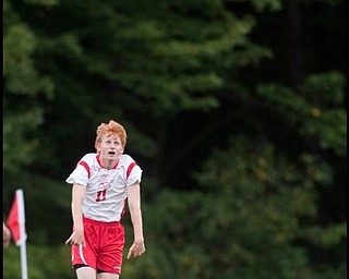 The Vindicator/Geoffrey HauschildMathew's David Kiepper (11) throws the ball back into play during the first half of a game at Mathews on Thursday evening. The game ended in a tie 1-1.9.24.2009