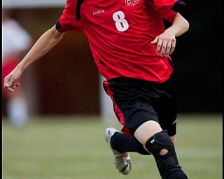 The Vindicator/Geoffrey HauschildColumbiana's Tommy Saunders (8) heads downfield with the ball during a game at Mathews on Thursday evening. The game ended in a tie 1-1.9.24.2009