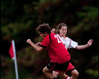 The Vindicator/Geoffrey HauschildColumbiana's Marc Frenger (27) regains control of the ball while defended by Mathew's Sarah Courey (2)during a game at Mathews on Thursday evening. The game ended in a tie 1-1.9.24.2009
