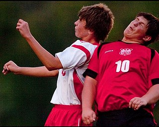 The Vindicator/Geoffrey HauschildColumbiana's Shane Williams (10) and Mathews' Tyler Hovanec (9) after going up for a header during the second half of a game at Mathews on Thursday evening. The game ended in a tie 1-1.9.24.2009
