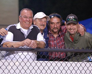 Fred Nolfi, John Perry, Ed Tkach and Tom Pilkington find ways to amuse themselves while watching the Lowellville / McDonald game.