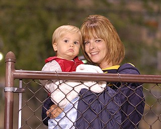Jordan Perry watches the Lowellville High School marching band with his Aunt, Michele Perry.