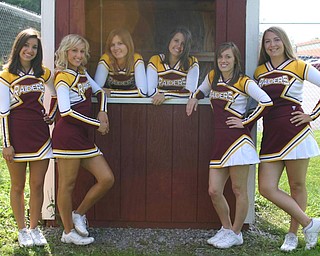 "South Range Senior cheerleaders wait for the Raider fans to arrive
for the first home football game."
