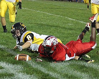 CRESTVIEW - COLUMBIANA - (32) Mardell Halas of Columbiana and (8) Jacob Danks fight for a lose ball during their game Friday night. - Special to The Vindicator/Nick Mays