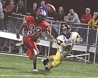 CRESTVIEW - COLUMBIANA - (8) Jacob Danks lays out for the ball as (32) Mardell Halas plays defense during their game Friday night. - Special to The Vindicator/Nick Mays