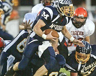 Nick Cupan of McDonald scrambles for yardage during Friday game with Wellsville. wdlewis