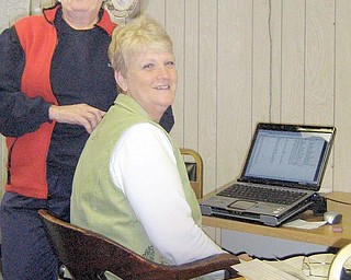 RECORDS KEEPERS: Linda McElroy, seated, and Mary Ann Creatore work at the Columbiana County Archives and Research Center, which contains a variety of records and information.