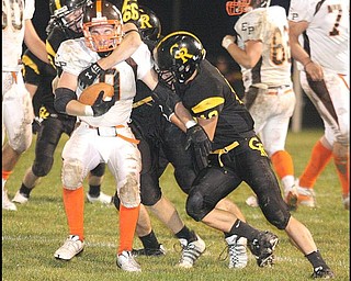 CRESTVIEW - EAST PALESTINE - The Crestview defense puts the stop on (9) Ryan Dilworth during their game Friday night. - Special to The Vindicator/Nick Mays
