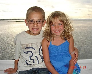 Michael Cougras, 8, and his sister, Connie, 6, of Poland are at the Chesapeake Bay at Ocean City, Md., in July.